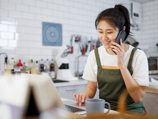 Merchant on their phone using Virtual Terminal